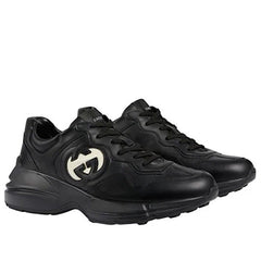 GUCCI Baskets Rhyton à logo entrelacé Noir ivoire.